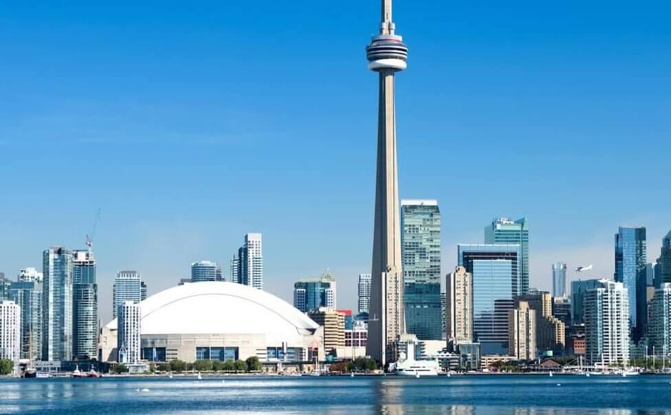 About Us: Toronto'S Skyline Showcases The Iconic Cn Tower In The Background.
